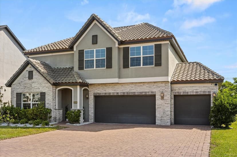 Welcome to an extraordinary residence nestled in the highly sought-after Oakland Trails community—just steps from the scenic West Orange Trail and moments from the charm of downtown Winter Garden